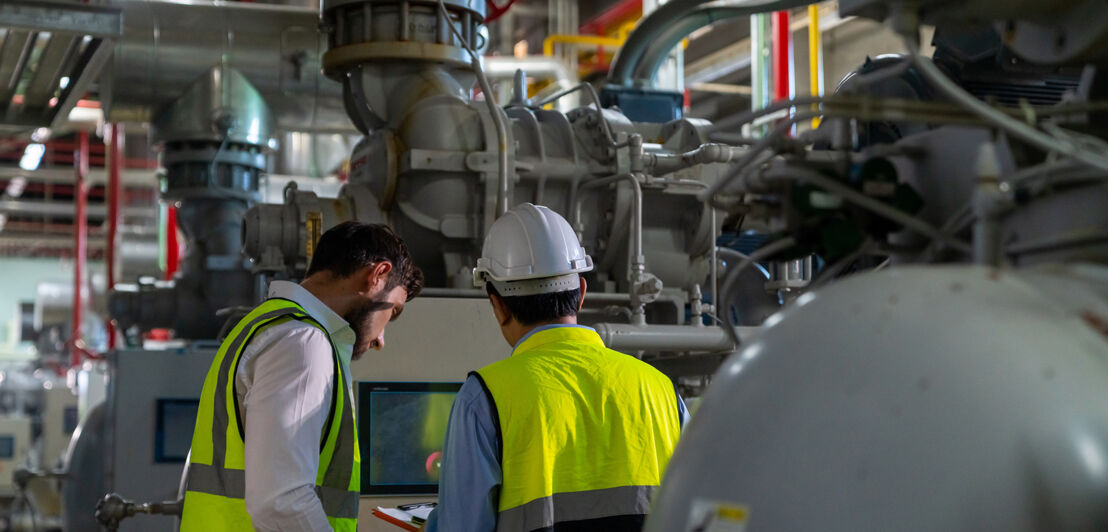 Two professional electrical engineer in safety uniform