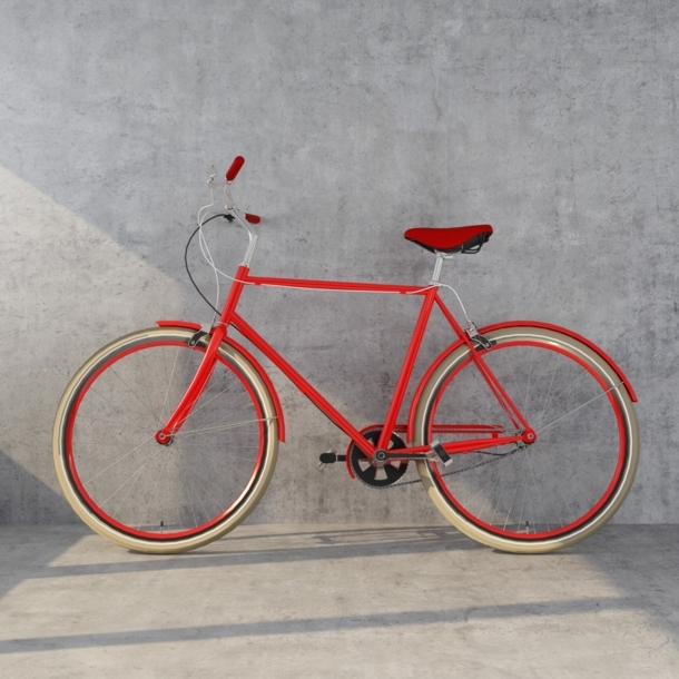 Ein orangefarbenes Designerfahrrad mit Ledersattel vor einer Betonwand